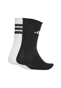Due paia di calze corte: una nera con accenti e strisce bianche, l'altra bianca solida con una texture a costine. Entrambi sono realizzati in tessuto a maglia.