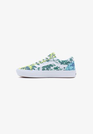 Low-top sneaker with white sole, white laces, and multi-color floral pattern in yellow, white, and blue panels on canvas upper.