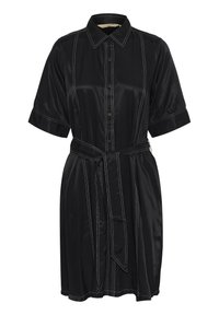 Melna kleita no satīna auduma, ar īsām piedurknēm, pogām priekšā un kontrastējošām baltām šuvēm. Komplektā ir auduma josta.