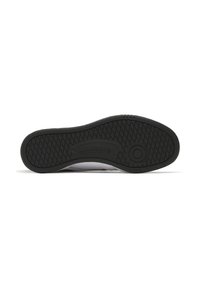Sola do sapato Reebok em borracha preta com um padrão de aderência texturizado, apresentando uma borda branca lisa e uma área central com a marca.