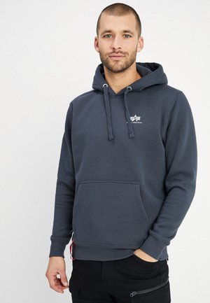 Dark gray hoodie featuring a front pocket, drawstring hood, and a small white logo on the chest. Cotton blend with a soft texture.