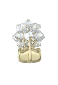 Design di una esplosione di stelle in cristallo trasparente con facce appuntite, montato in metallo color oro. Presenta una base liscia e arrotondata con un picco centrale prominente.