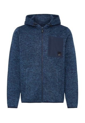 Sudadera con cremallera de punto azul, con capucha ajustable y un bolsillo de parche en contraste en color azul marino. Puños acanalados. Tejido texturizado en toda la prenda.