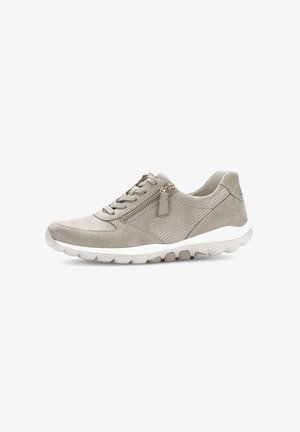 Light grey suede sneaker with textured side panels, lace-up design, and zip accent. Features a white sole and rounded toe shape.