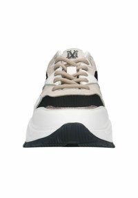 Chunky sneaker featuring a white and black upper with beige suede accents, textured mesh panels, round laces, and a black rubber sole.