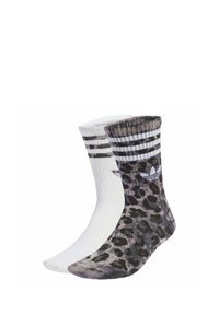 Pari sukat: yksi yksivärinen valkoinen, toinen harmaa leopardi-kuvioinen. Molemmissa on raidallinen ribattu vartti, jossa on Adidas-logo.