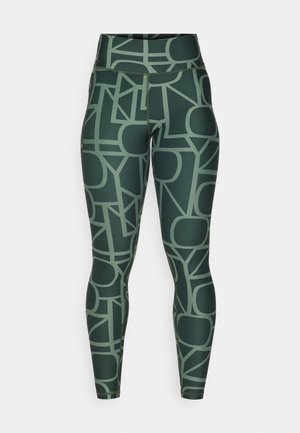 Høytlivte grønne leggings med et geometrisk mønster i dempede toner. Laget av elastisk, glatt stoff med en tettsittende silhuett.