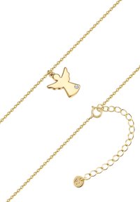 Zeltītas kaklarotas ar eņģeļa spārna piekariņu, kurā ir neliela caurspīdīga akmens. Smalka ķēdīte un regulējams aizdare, kas nodrošina pielāgojamu iedobi.