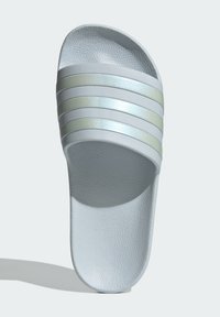 Light gray slide sandal with three matte silver stripes, textured upper surface, flat sole, and open toe design.