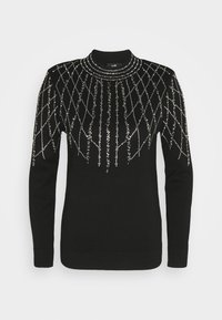 Pull noir à col haut, orné de strass argentés disposés en motif losange sur le devant. Texture douce, manches longues.