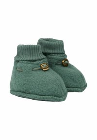 Grüne Filzschuhe mit gestrickten Bündchen, runder Form, dekorativen Knopfakzenten und gestickten Details. Weicher und gemütlicher Stoff.