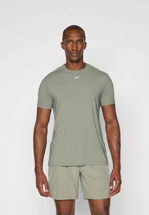 Short-sleeve athletic t-shirt in soft, olive green fabric with a round neckline, featuring mesh accents and a small logo on the chest.