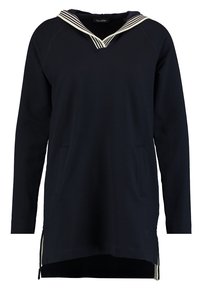 Sudadera azul marino con cuello en V a rayas, mangas largas, bolsillos frontales y aberturas laterales para mayor libertad de movimiento. Tejido de algodón suave.