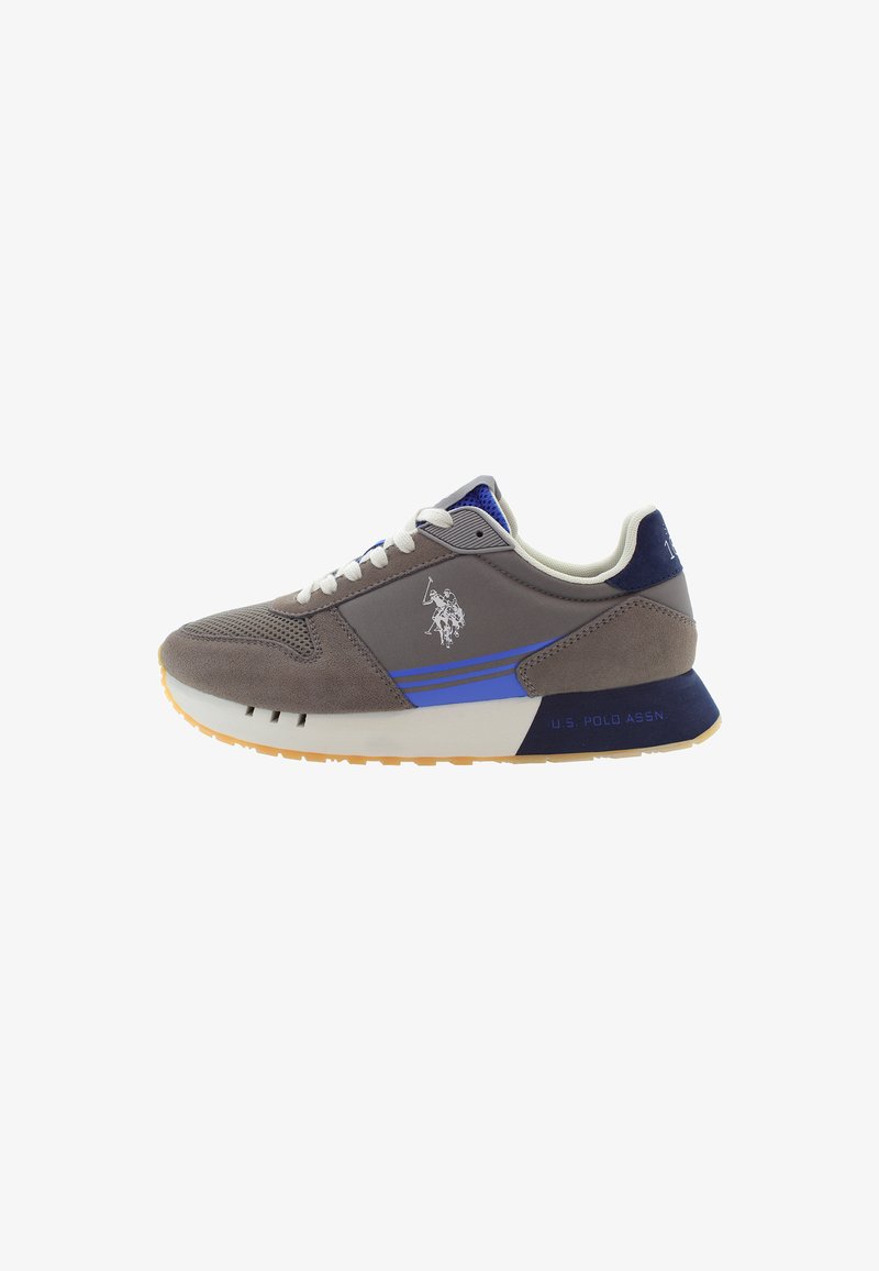 Gray suede sneaker with blue accents, white laces, and a textured toe. Features a logo and "U.S. Polo Assn." on the heel. Rubber sole.