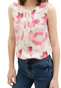 Blouse sans manches blanche avec de grands motifs abstraits roses et violets. Dotée d'un col rond et de légères plis sur le devant.