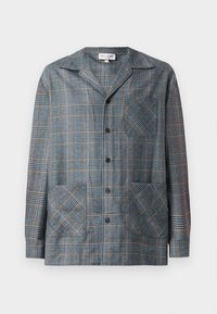 Triibuline jakk sinises, hallis ja oranžis. Valmistatud sujuva tekstuuriga kangast. Omab kraed, esipaneeli nuppe ja kahte suurt kott-taskut.