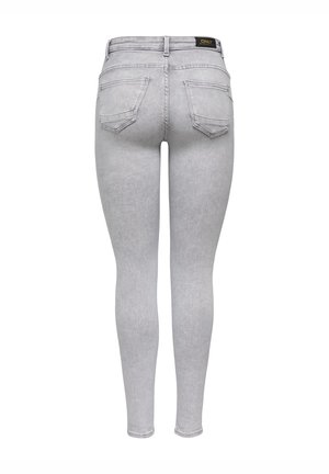 Gray skinny jeans made of denim. Features include a high waist, five pockets, and a smooth texture with a slight fade. Label visible on back waist.