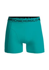 Türkiz boxer alsónadrág fekete rugalmas derékkal. Az anyag simának és ruganyosnak tűnik, a derékpánton logóval.