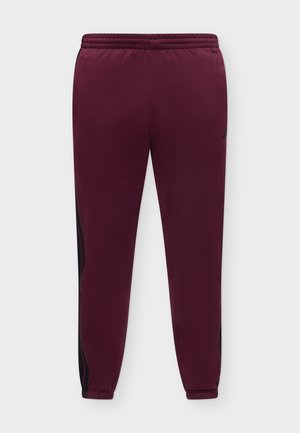 adidas Sportswear, ESSENTIALS 3 STRIPES TAPERED CUFFED PANTS - Долнище на анцуг - team maroon/black