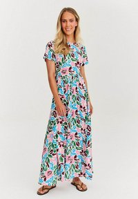 Maxi šaty s květinovým vzorem v růžové, zelené a modré barvě. Krátké rukávy, kulatý výstřih a nařasený pas pro vzdušný siluetu.