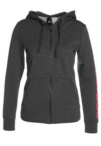 Szara bluza z kapturem na zamek, z przednimi kieszeniami i czarnymi sznurkami. Posiada duże różowe logo na prawym rękawie. Wykonana z miękkiego materiału.