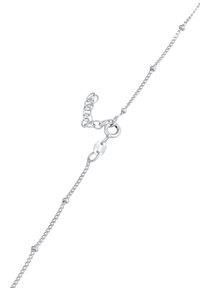 Sølv kædearmbånd med led og perler, udstyret med en fjederlås og en justerbar forlængerkæde til tilpasning af størrelsen.