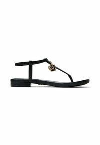 Black flat sandals with a T-strap design, featuring a smooth texture, a decorative gold charm, and a minimalistic sole.