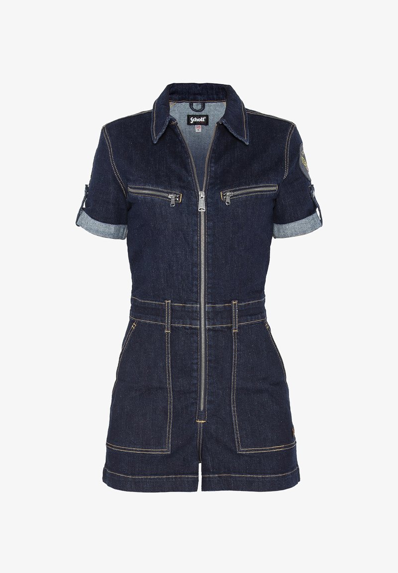 Tuta in denim con maniche corte, tessuto blu scuro, zip frontale, due tasche sul petto e polsini delle maniche arrotolati. Cuciture a contrasto in tutto il capo.