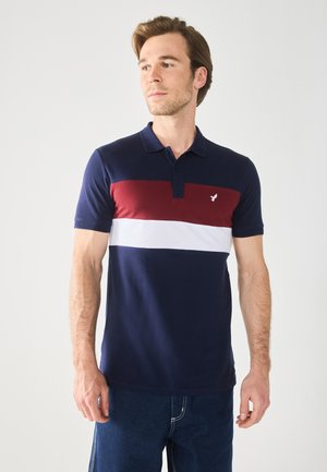 Navy polo shirt with maroon and white horizontal stripes, short sleeves, and a three-button placket. Small logo on the chest.