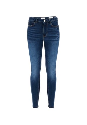 Kitsad teksad tumesinises denimis kõrge vöökoht, viis taskut ja vaskne puu. Omab keskmist esist nuppu ja tõmblukk.