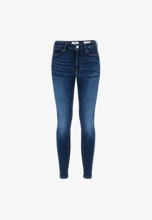 Eng skinny Jeans aus dunkelblauem Denim mit hohem Bund, fünf Taschen und kupferfarbenen Nähten; ausgestattet mit einem zentralen Knopf und Reißverschluss vorne.