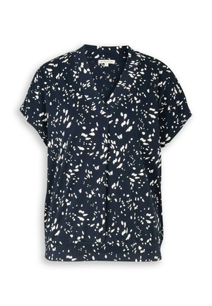Blouse bleu marine à manches courtes avec motif de points blancs irréguliers, encolure en V et coupe décontractée.