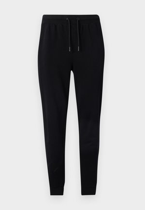 Joggers athlétiques noirs en tissu doux avec une taille à cordon de serrage, des jambes fuselées et des poignets ajustés. Pas de motifs ni d'accents visibles.