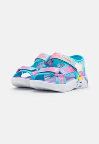 Lightweight sandals with a blue, pink, and purple color scheme. Features adjustable straps, a unicorn detail, and textured rubber sole.