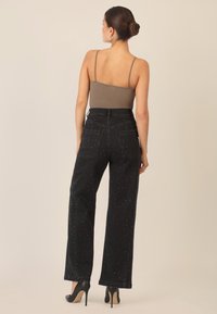 Apart WEITE MIT KRISTALLSTEINEN - Straight leg -farkut - schwarz