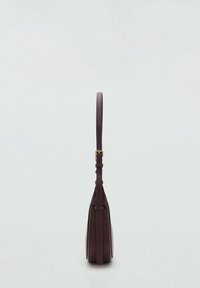 Dark purple leather bag with a slim shape, adjustable strap, and gold-tone buckle accent. Smooth texture with minimalistic design.