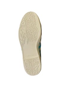 Semelle d'une chaussure blanche montrant un motif de texture et un marquage de taille 37 sur un fond clair.