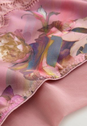 Floral patterned fabric in shades of pink, featuring a smooth texture with a lace trim along the edge and a soft, matte pink underside.