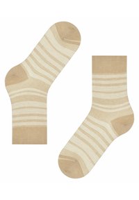 Beige Socken mit weißen Streifen, ausgestattet mit einer verstärkten Zehen- und Fersenpartie. Strickstoff mit einer glatten Textur und einem Design in mittlerer Wadenlänge.