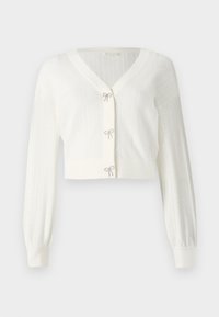 Cardigan blanc court en tricot texturé, avec de longues manches bouffantes et des nœuds décoratifs aux fermetures avant.