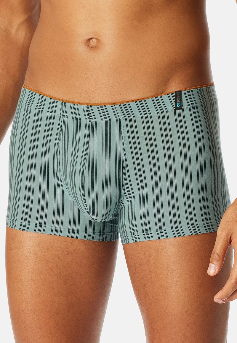 Boxer briefs in a light teal color with black vertical stripes. Soft fabric with an elastic waistband and a front pouch design.