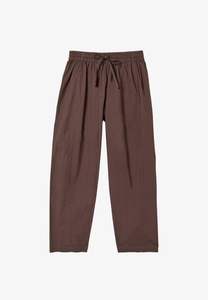 Hnedé voľné nohavice s elastickým pásom a šnúrou, s bočnými vreckami s rozparkom a rovnou nohavicou.