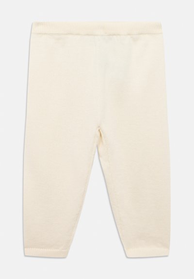 Εσώρουχα μωρού σε κρεμ απόχρωση, κατασκευασμένα από απαλό πλεκτό ύφασμα, με ελαστική μέση και στενά πόδια για άνετη εφαρμογή.