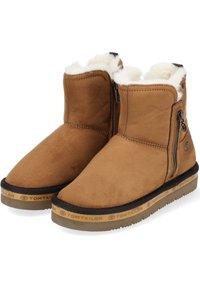 Bottines en suède marron avec doublure en fausse fourrure, fermeture éclair latérale et semelle en caoutchouc avec un bandeau logo circulaire. Texture lisse, design à bout arrondi.