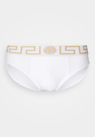 Slip di cotone bianco con cintura logata dorata caratterizzata da un motivo a chiave greca e dettaglio centrale a medaglione, che offre un design aderente.
