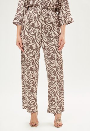 Bruine en crème gestreepte broek met een relaxte pasvorm, elastische tailleband en koorddetail. Gemaakt van lichte stof.