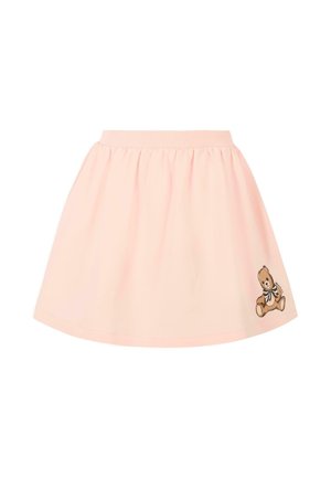 Jupe en coton rose avec une texture douce et une taille élastique. Présente un graphique de nounours sur le bas à droite.