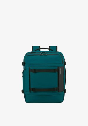 Teal rectangular backpack with multiple zippered compartments, black straps, and a top handle, designed for travel and daily use.