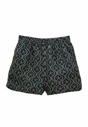 Black elastic waist shorts with white starfish and wavy line pattern repeated across the fabric.