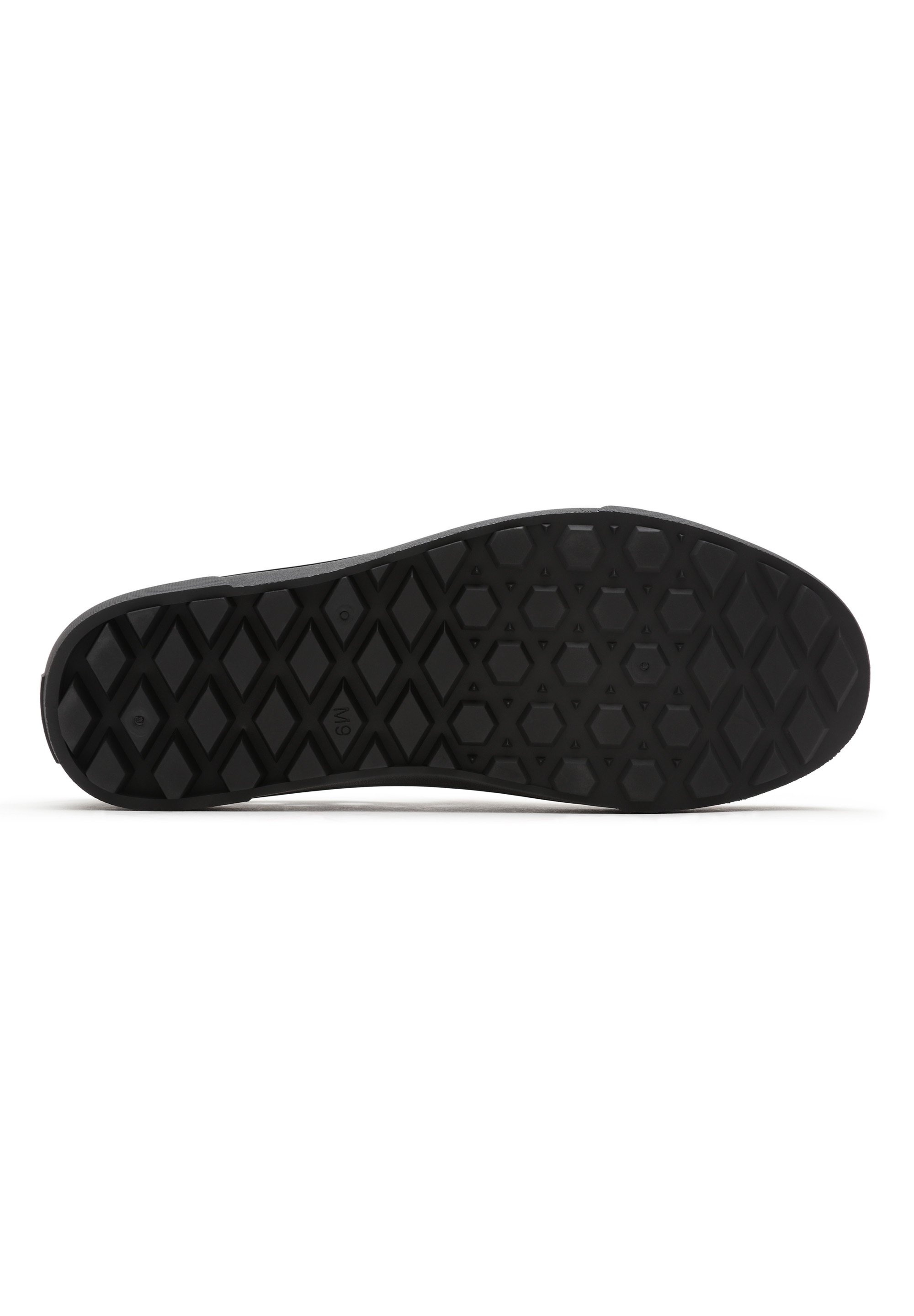 black sole slip on vans